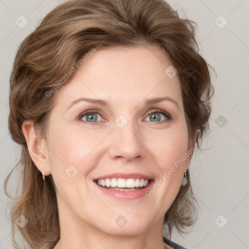 Joyful white young-adult female with medium  brown hair and blue eyes