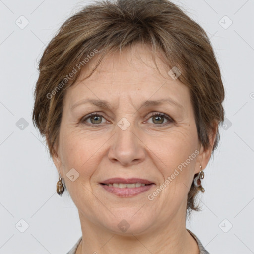 Joyful white adult female with short  brown hair and brown eyes