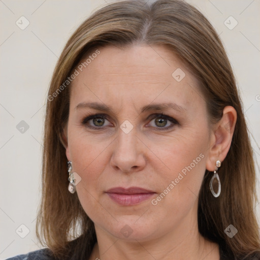 Joyful white adult female with medium  brown hair and grey eyes