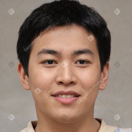 Joyful asian young-adult male with short  brown hair and brown eyes