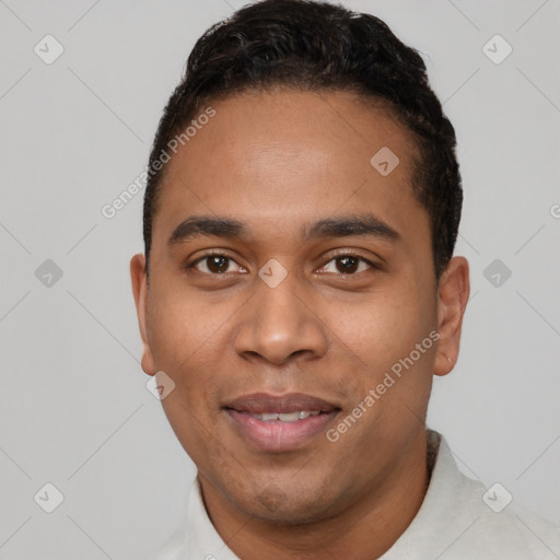 Joyful latino young-adult male with short  black hair and brown eyes