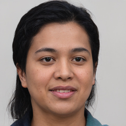 Joyful asian young-adult female with medium  brown hair and brown eyes