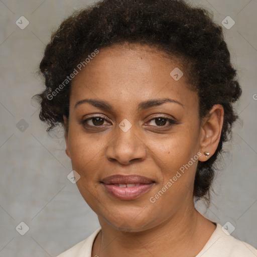 Joyful black adult female with short  brown hair and brown eyes