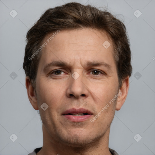 Joyful white adult male with short  brown hair and grey eyes