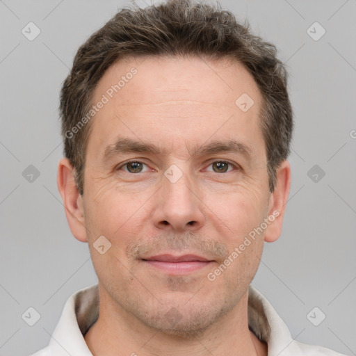 Joyful white adult male with short  brown hair and grey eyes