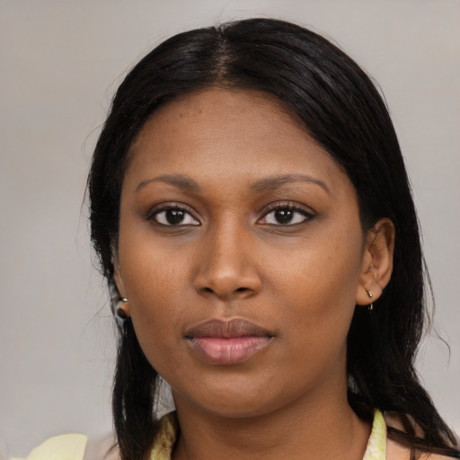 Neutral black young-adult female with medium  black hair and brown eyes