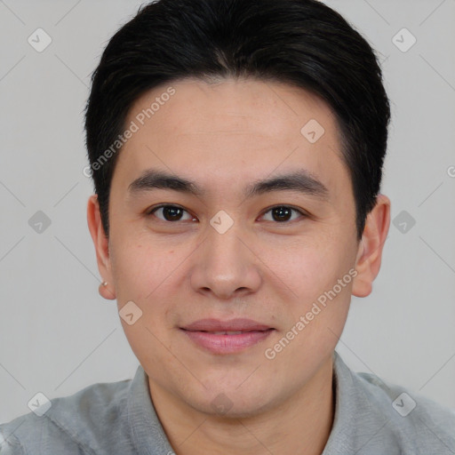 Joyful asian young-adult male with short  black hair and brown eyes