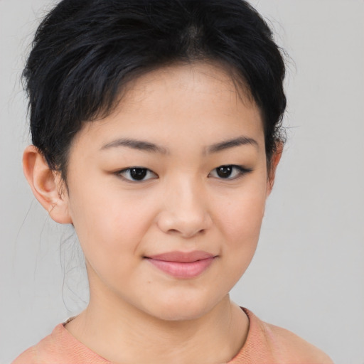 Joyful asian young-adult female with short  brown hair and brown eyes