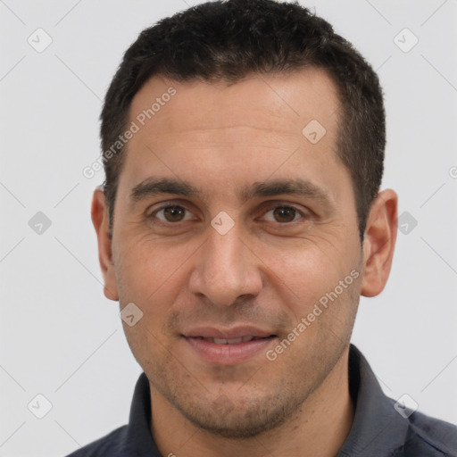 Joyful white adult male with short  brown hair and brown eyes