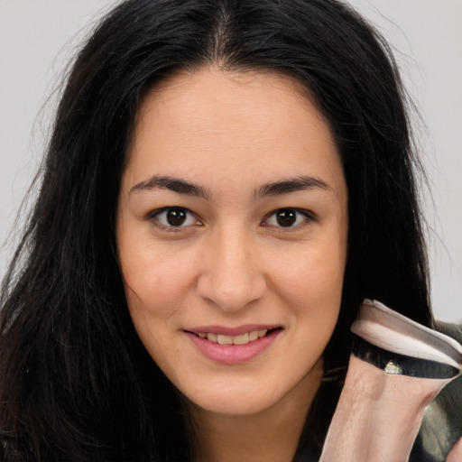 Joyful asian young-adult female with long  brown hair and brown eyes