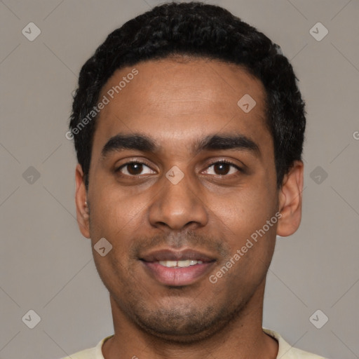 Joyful black young-adult male with short  black hair and brown eyes