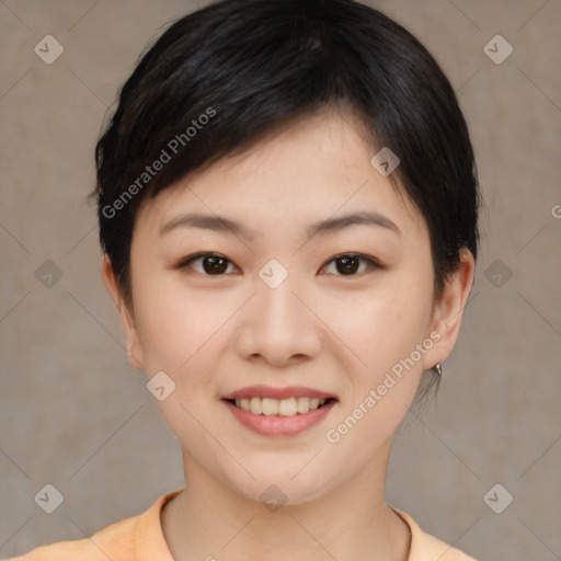 Joyful asian young-adult female with short  brown hair and brown eyes