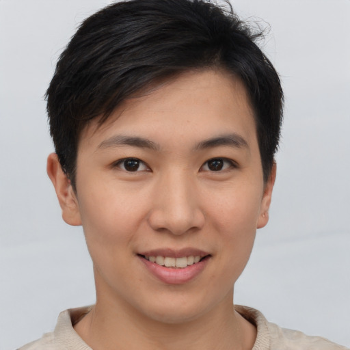Joyful asian young-adult female with short  brown hair and brown eyes