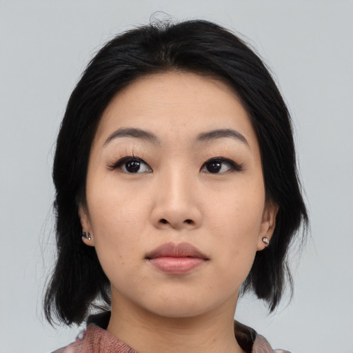 Neutral asian young-adult female with medium  black hair and brown eyes