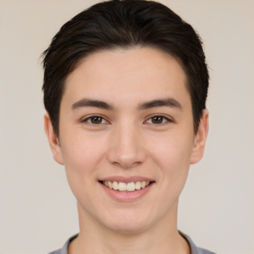 Joyful white young-adult female with short  brown hair and brown eyes