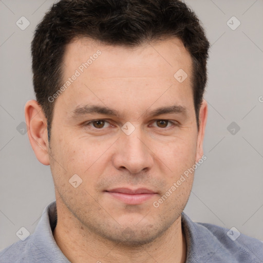 Joyful white young-adult male with short  brown hair and brown eyes