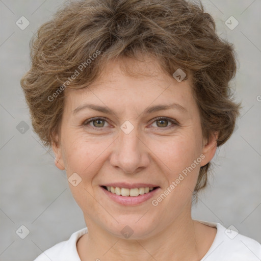 Joyful white adult female with short  brown hair and brown eyes