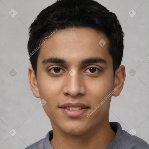 Joyful latino young-adult male with short  black hair and brown eyes