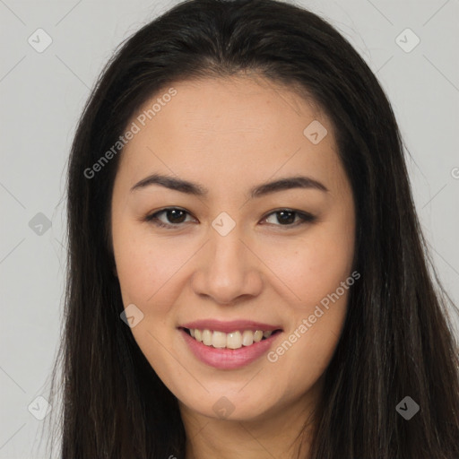 Joyful asian young-adult female with long  brown hair and brown eyes