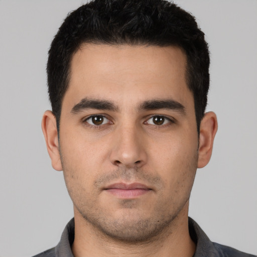 Neutral white young-adult male with short  black hair and brown eyes