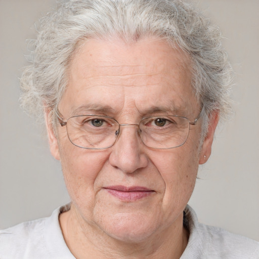 Joyful white middle-aged male with short  gray hair and blue eyes