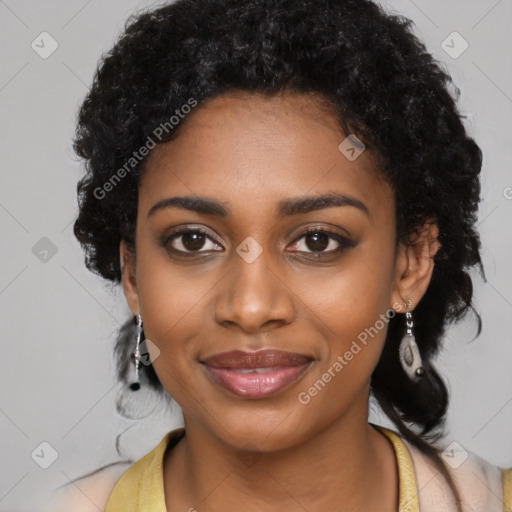 Joyful black young-adult female with long  black hair and brown eyes