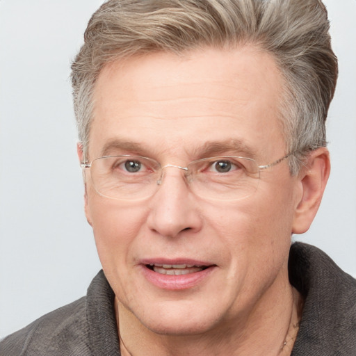 Joyful white middle-aged male with short  brown hair and grey eyes