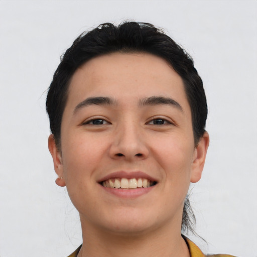 Joyful asian young-adult male with short  black hair and brown eyes