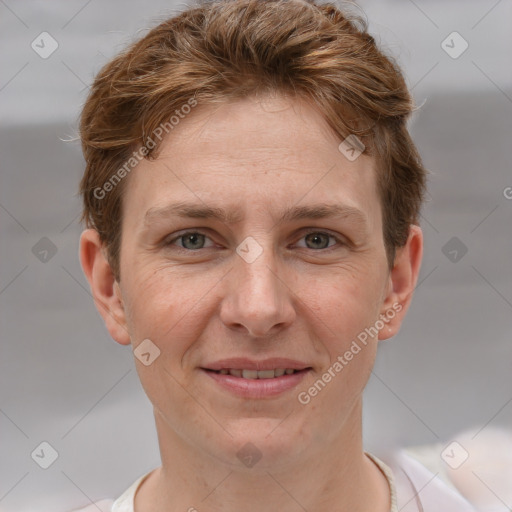 Joyful white adult female with short  brown hair and grey eyes