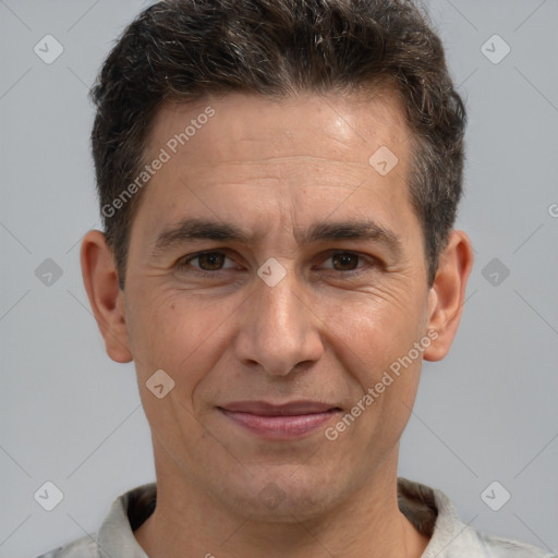 Joyful white adult male with short  brown hair and brown eyes