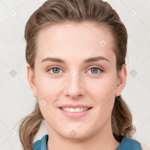 Joyful white young-adult female with medium  brown hair and blue eyes