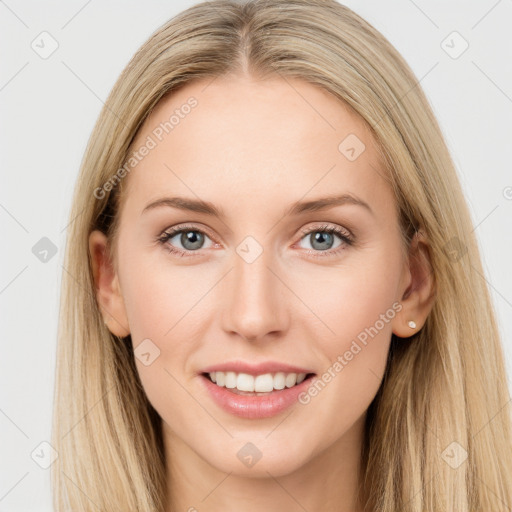 Joyful white young-adult female with long  brown hair and blue eyes