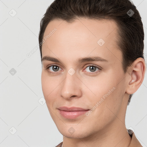 Joyful white young-adult female with short  brown hair and brown eyes