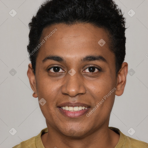 Joyful black young-adult male with short  black hair and brown eyes