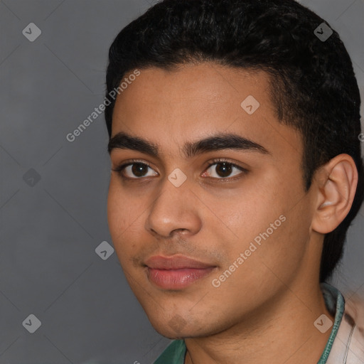 Joyful latino young-adult male with short  black hair and brown eyes