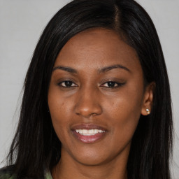 Joyful asian young-adult female with long  black hair and brown eyes