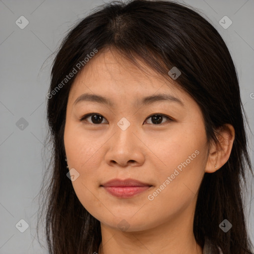 Joyful asian young-adult female with long  brown hair and brown eyes