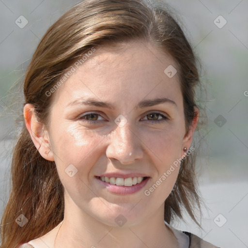 Joyful white young-adult female with medium  brown hair and grey eyes