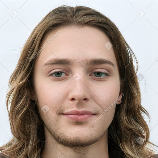 Neutral white young-adult male with long  brown hair and green eyes