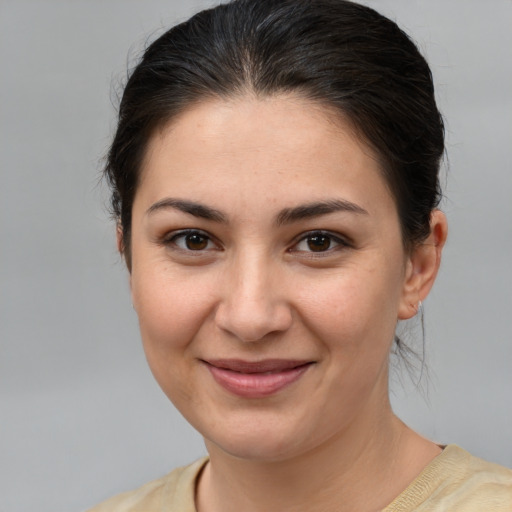 Joyful white young-adult female with medium  brown hair and brown eyes