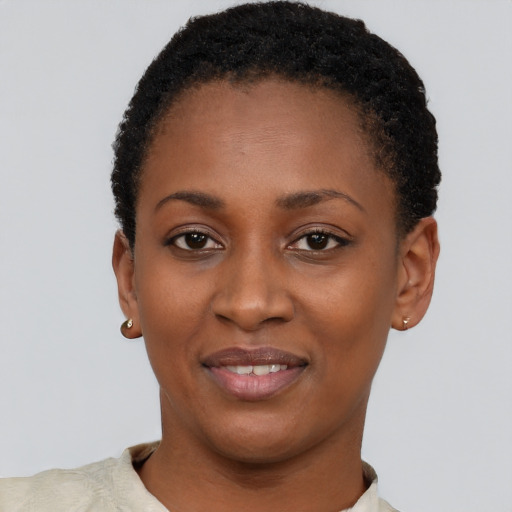 Joyful latino young-adult female with short  black hair and brown eyes