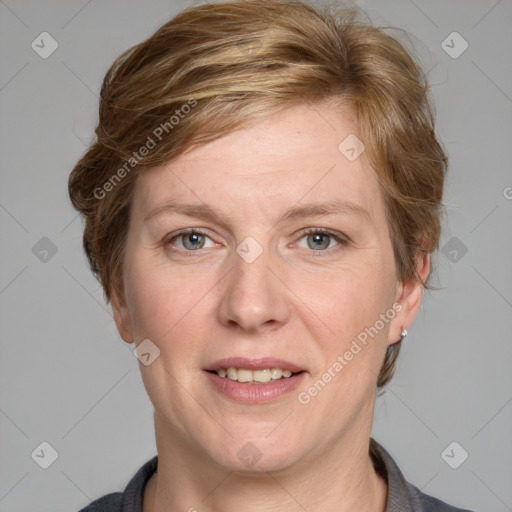 Joyful white adult female with medium  brown hair and blue eyes