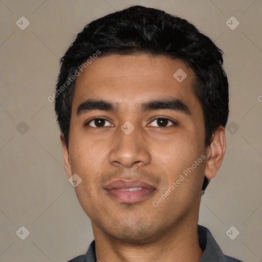 Joyful latino young-adult male with short  black hair and brown eyes