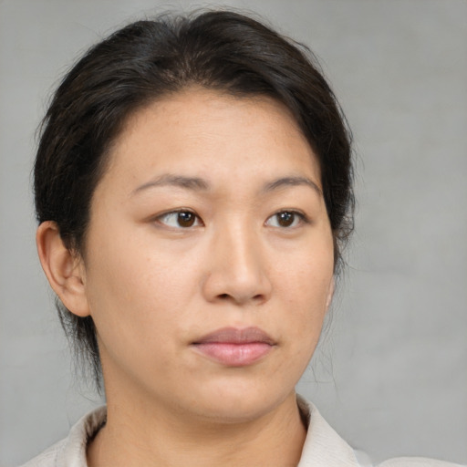 Neutral asian young-adult female with medium  brown hair and brown eyes