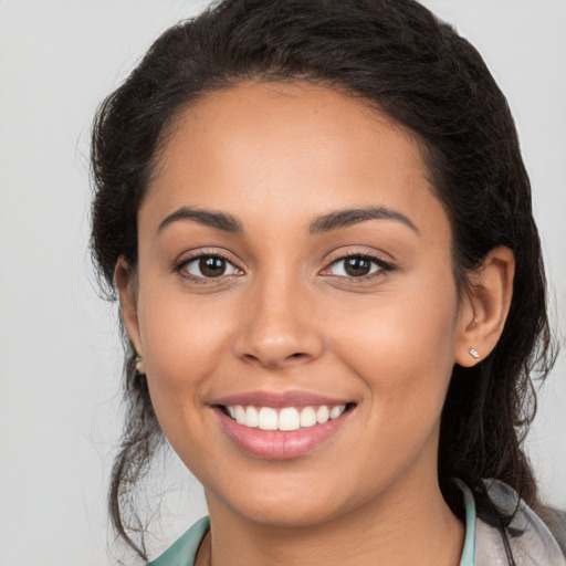 Joyful white young-adult female with long  brown hair and brown eyes