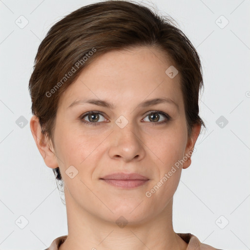 Joyful white young-adult female with short  brown hair and grey eyes