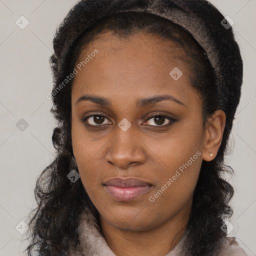 Neutral black young-adult female with long  brown hair and brown eyes