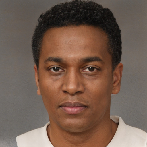 Neutral black young-adult male with short  black hair and brown eyes