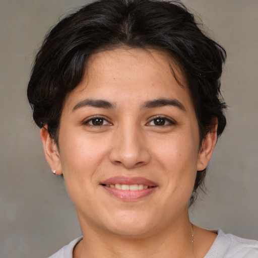 Joyful white young-adult female with medium  brown hair and brown eyes