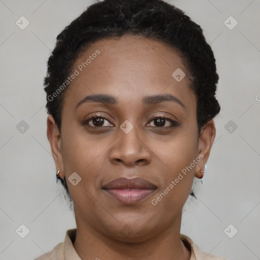 Joyful black young-adult female with short  black hair and brown eyes